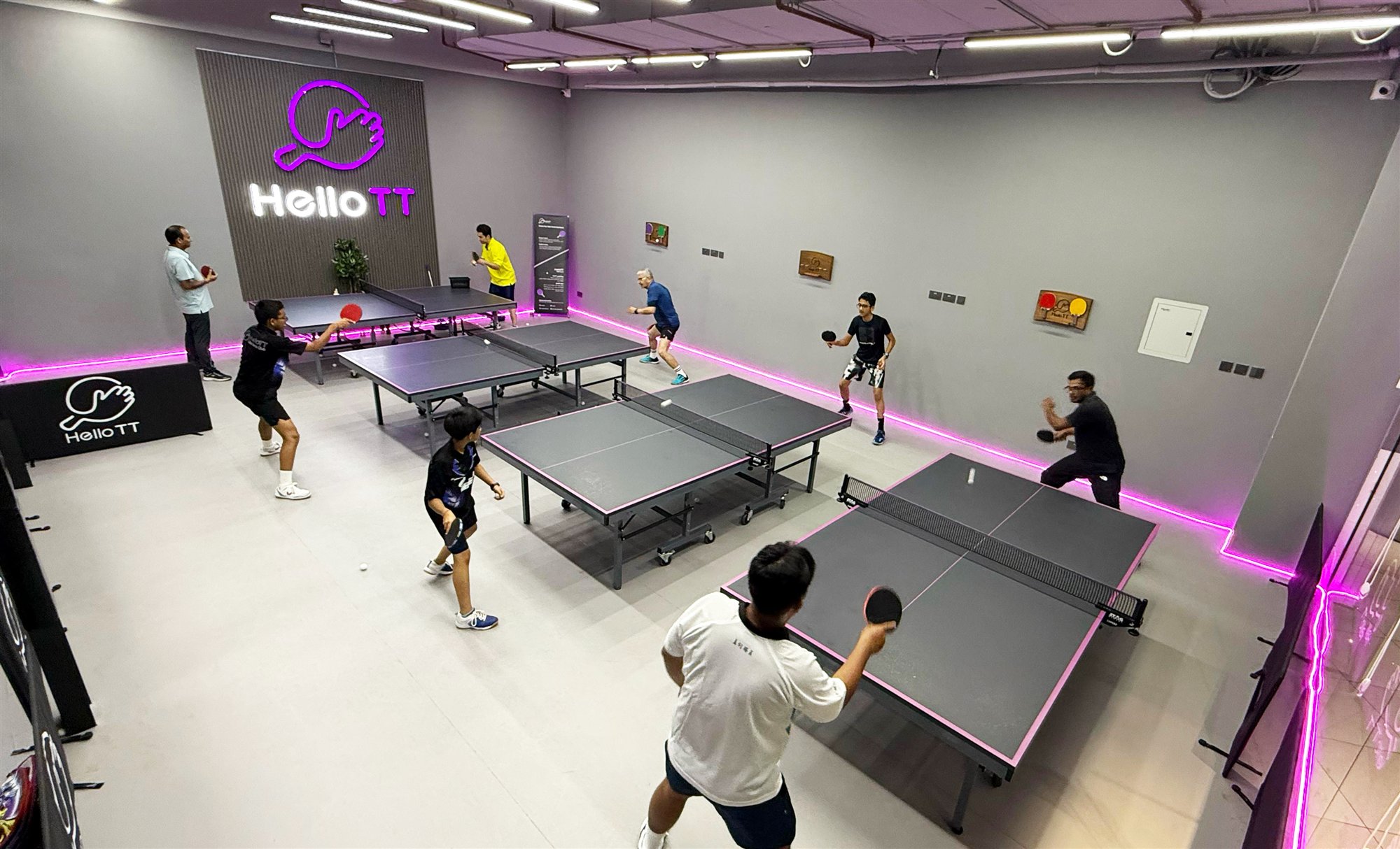 Players practising table tennis at HelloTT